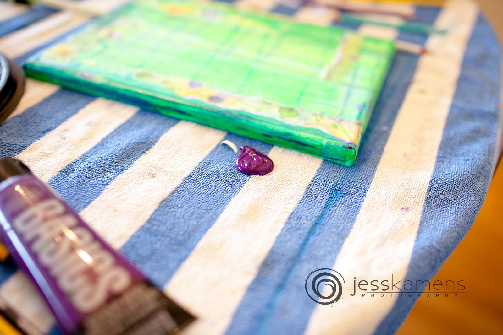 purple paint spilling onto a table