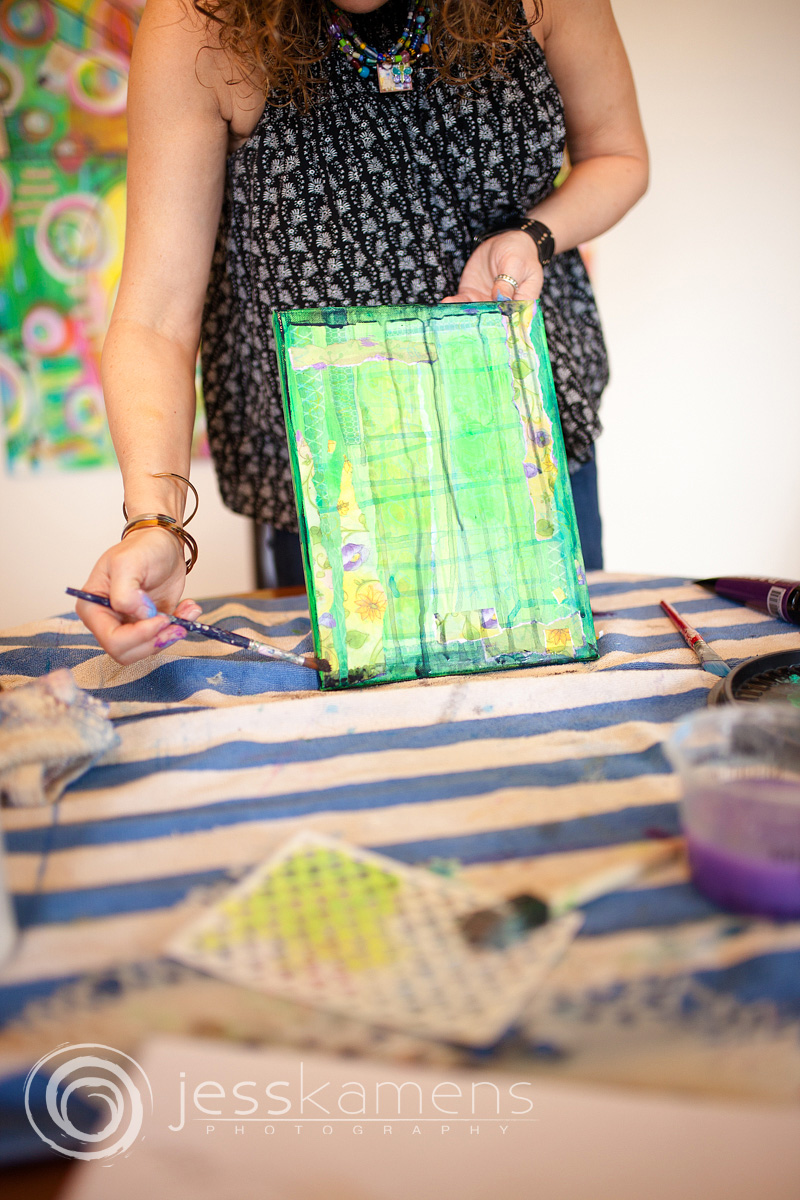 Renée painting the sides of her painting