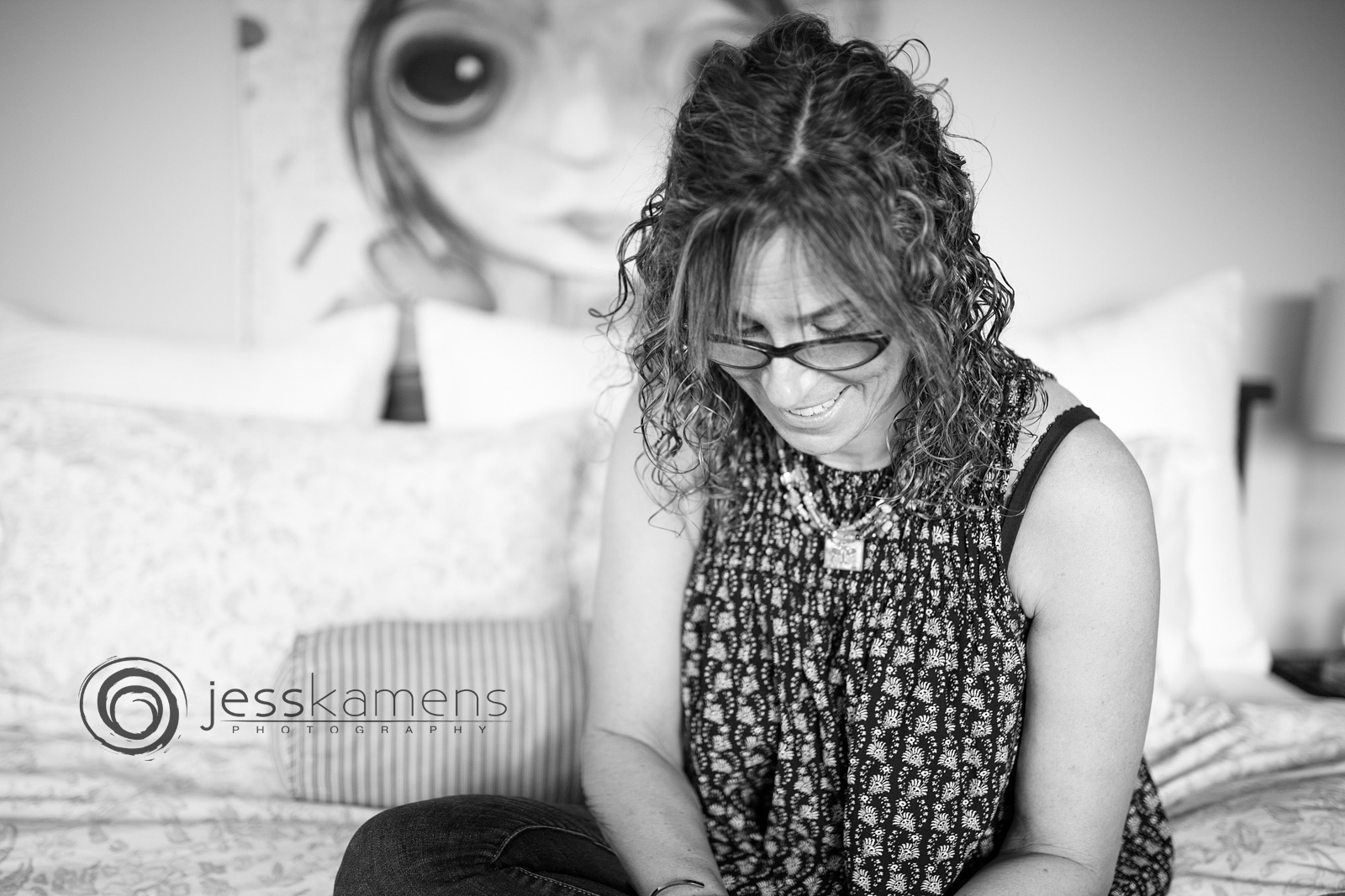 A woman in black and white laughing and enjoying life