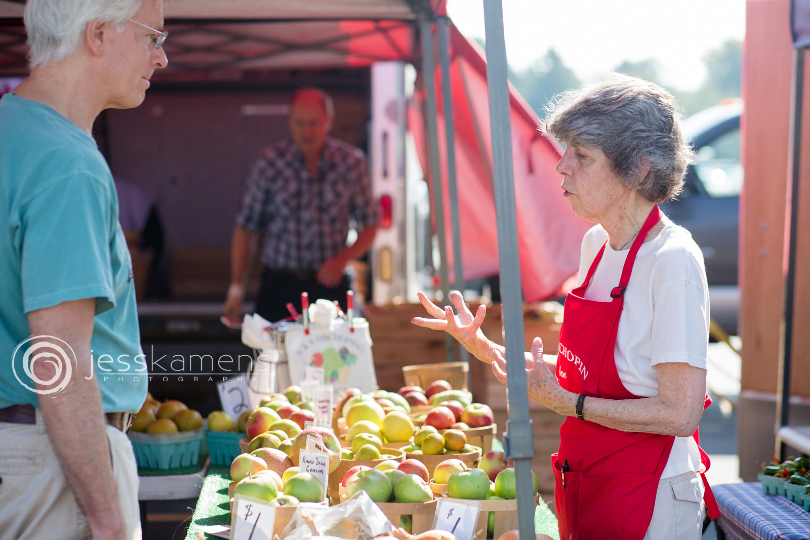 The owner of K&S Bischoping Farms from Williamson, NY explains apples to her customer