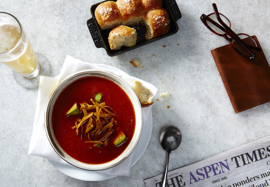 Lifestyle food in action photographed by Jessica Grenier showing a chef plating a dish.