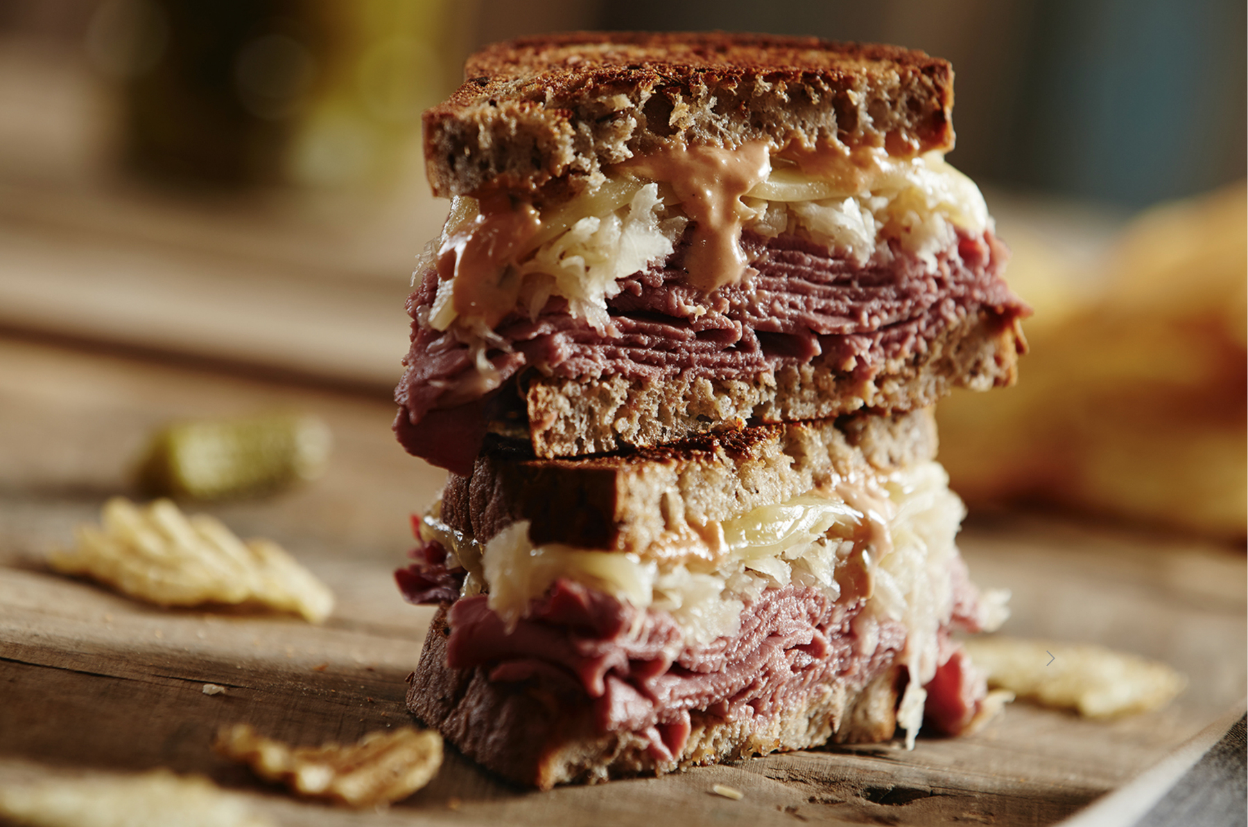 Food in motion image by Jessica Grenier capturing the pouring action of a sauce for advertising use.