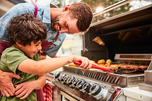 Lifestyle food in action photographed by Jessica Grenier showing a chef plating a dish.