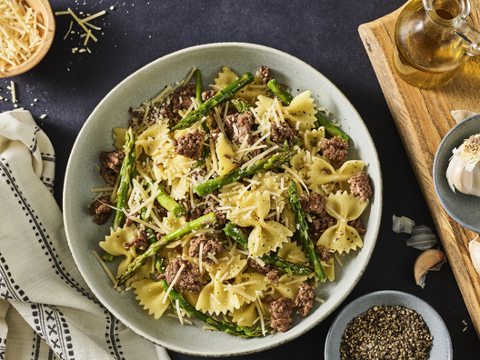 Food in motion image by Jessica Grenier capturing the pouring action of a sauce for advertising use.