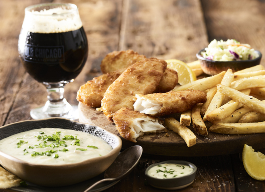 Food in motion image by Jessica Grenier capturing the pouring action of a sauce for advertising use.