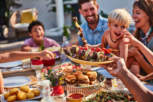 Lifestyle food in action photographed by Jessica Grenier showing a chef plating a dish.