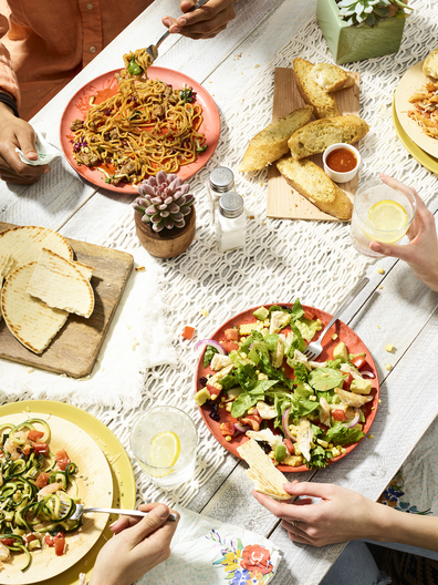 Lifestyle food in action photographed by Jessica Grenier showing a chef plating a dish.