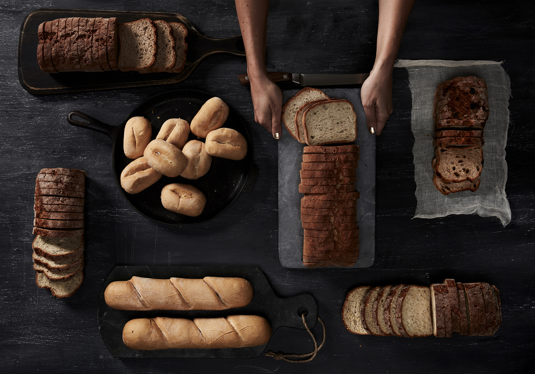 Lifestyle food in action photographed by Jessica Grenier showing a chef plating a dish.