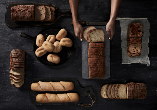 Lifestyle food in action photographed by Jessica Grenier showing a chef plating a dish.