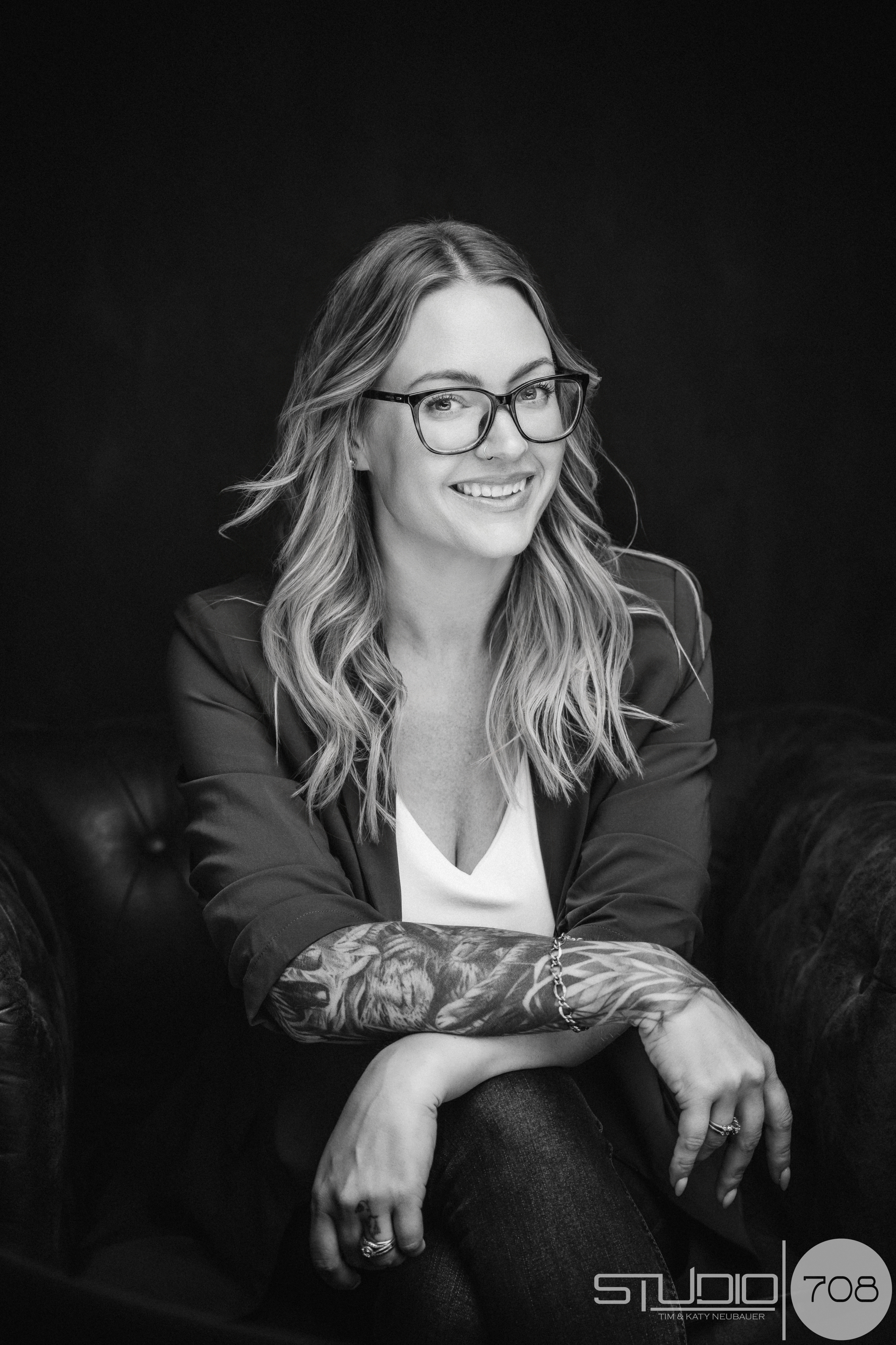 black and white beauty portrait of a woman wearing glasses