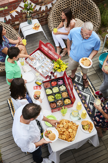 Lifestyle food in action photographed by Jessica Grenier showing a chef plating a dish.