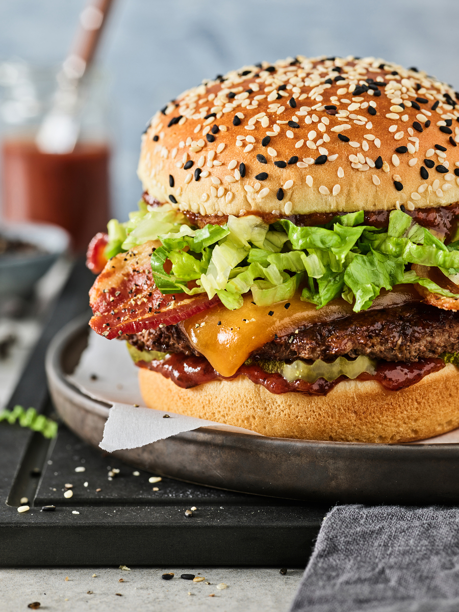 Lifestyle food in action photographed by Jessica Grenier showing a chef plating a dish.