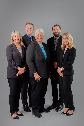Group business portrait on a grey backdrop in an Oshkosh Studio