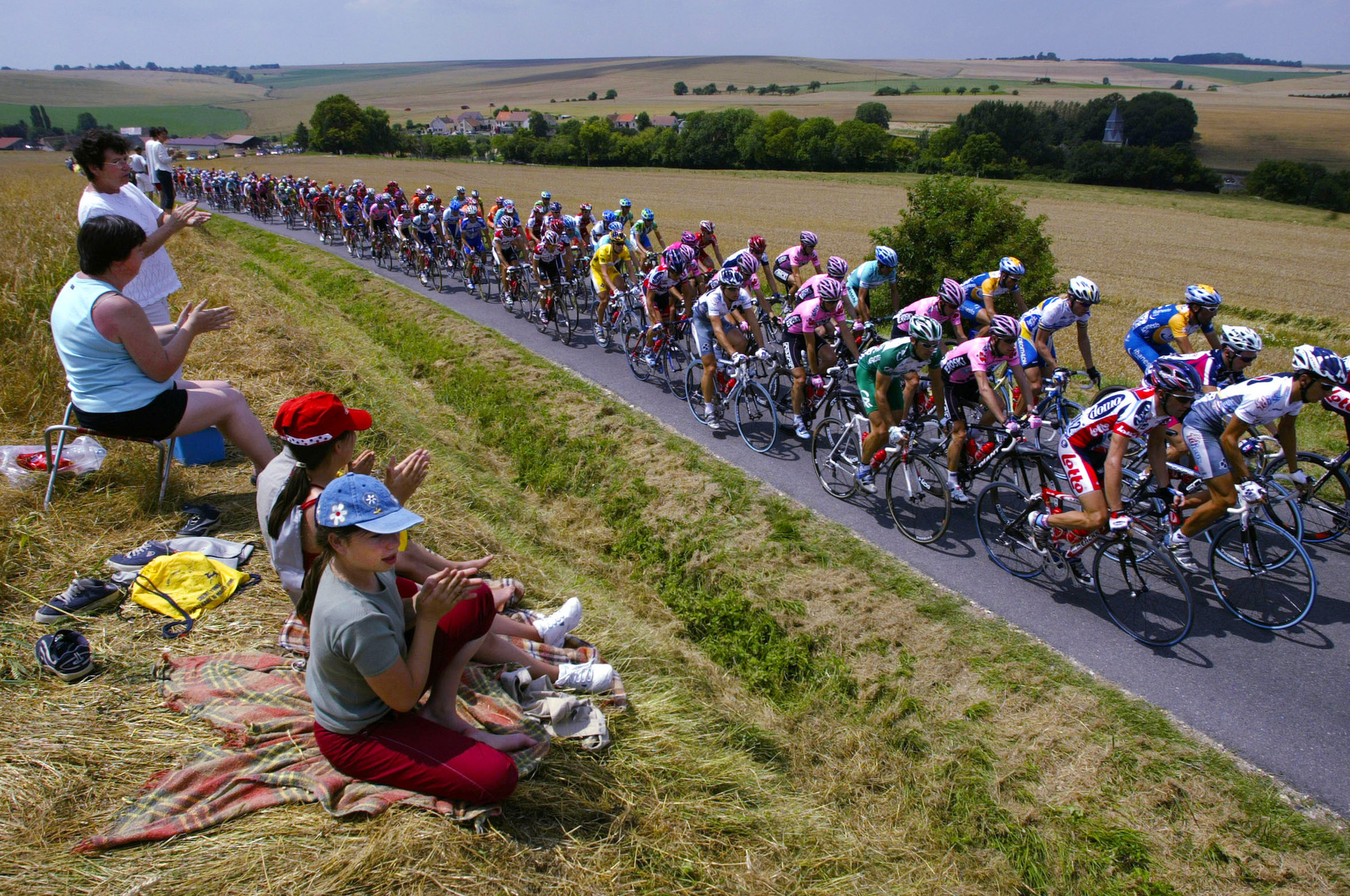 /SEDAN - JULY 7, 2003: The peleton rides through the french country side during stage 2 between La Ferte-Sous-Jouarre and Sedan during the Tour de France on July 7, 2003 in France. (Photo by Robert Laberge/Getty Images)