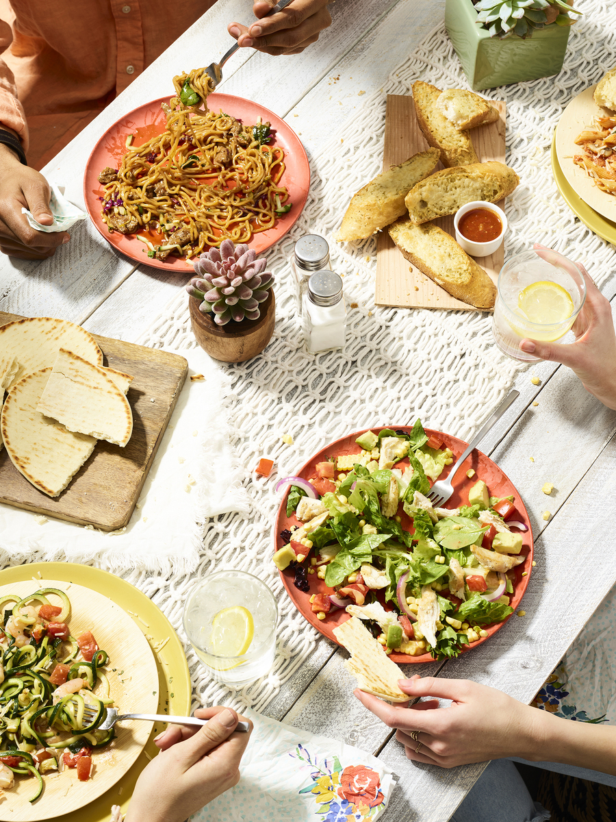 Lifestyle food in action photographed by Jessica Grenier showing a chef plating a dish.